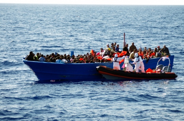 Around 100 people were missing, feared drowned, in the Mediterranean on Tuesday after a migrant dinghy capsized off Libya