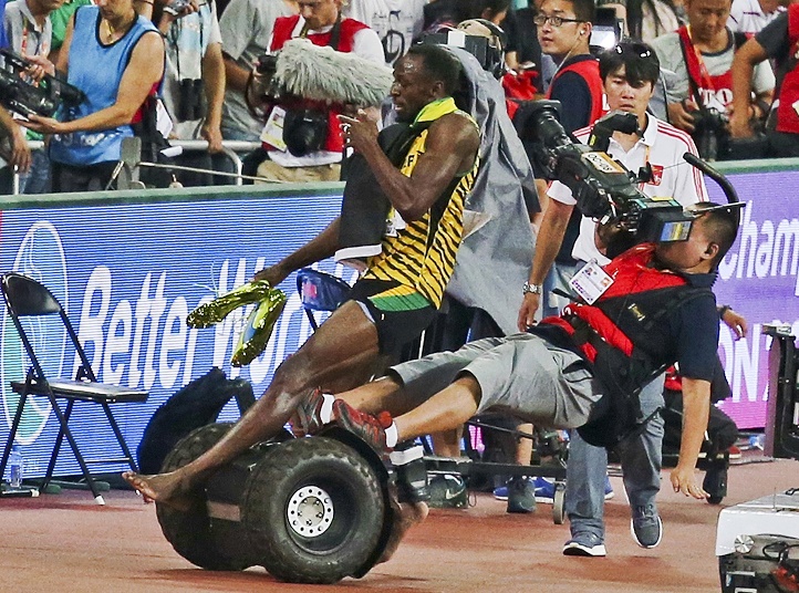 Itâ€™s Impossible To Topple Usain Bolt Unless Youâ€™re A Cameraman On A Scooty