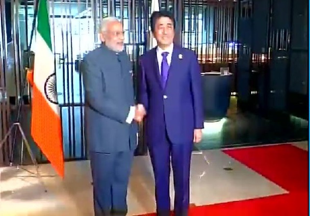 ASEAN goof-up: Modi meets Abe, in front of an upside down Tricolour 