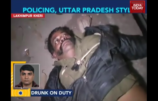 Watch A Drunk Cop In UP Lying On The Road While On Duty
